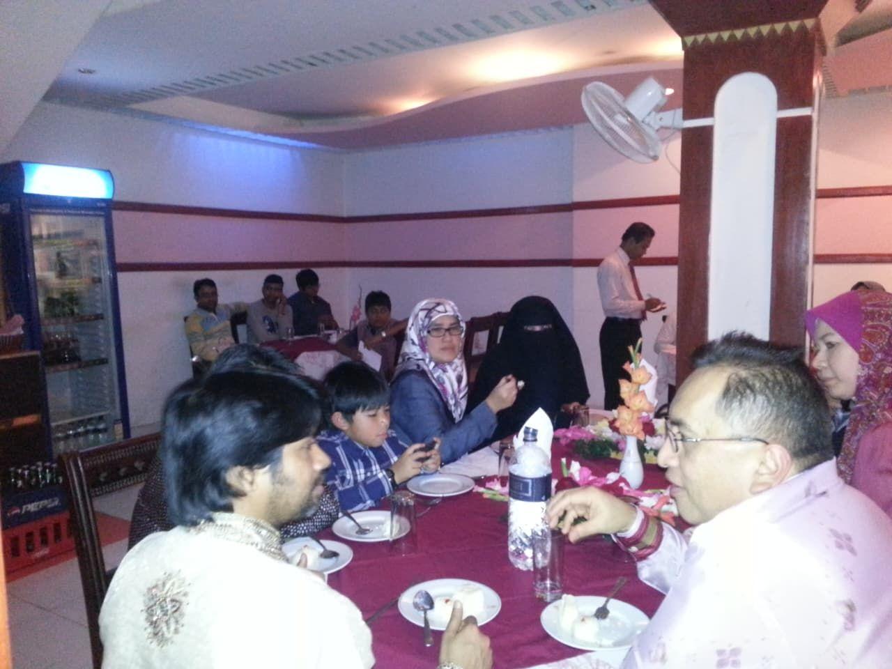 Families dining together at laid tables in the restaurant