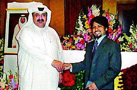 S. M. Zillur Rahman shaking hands with a Qatari dignitary at a reception